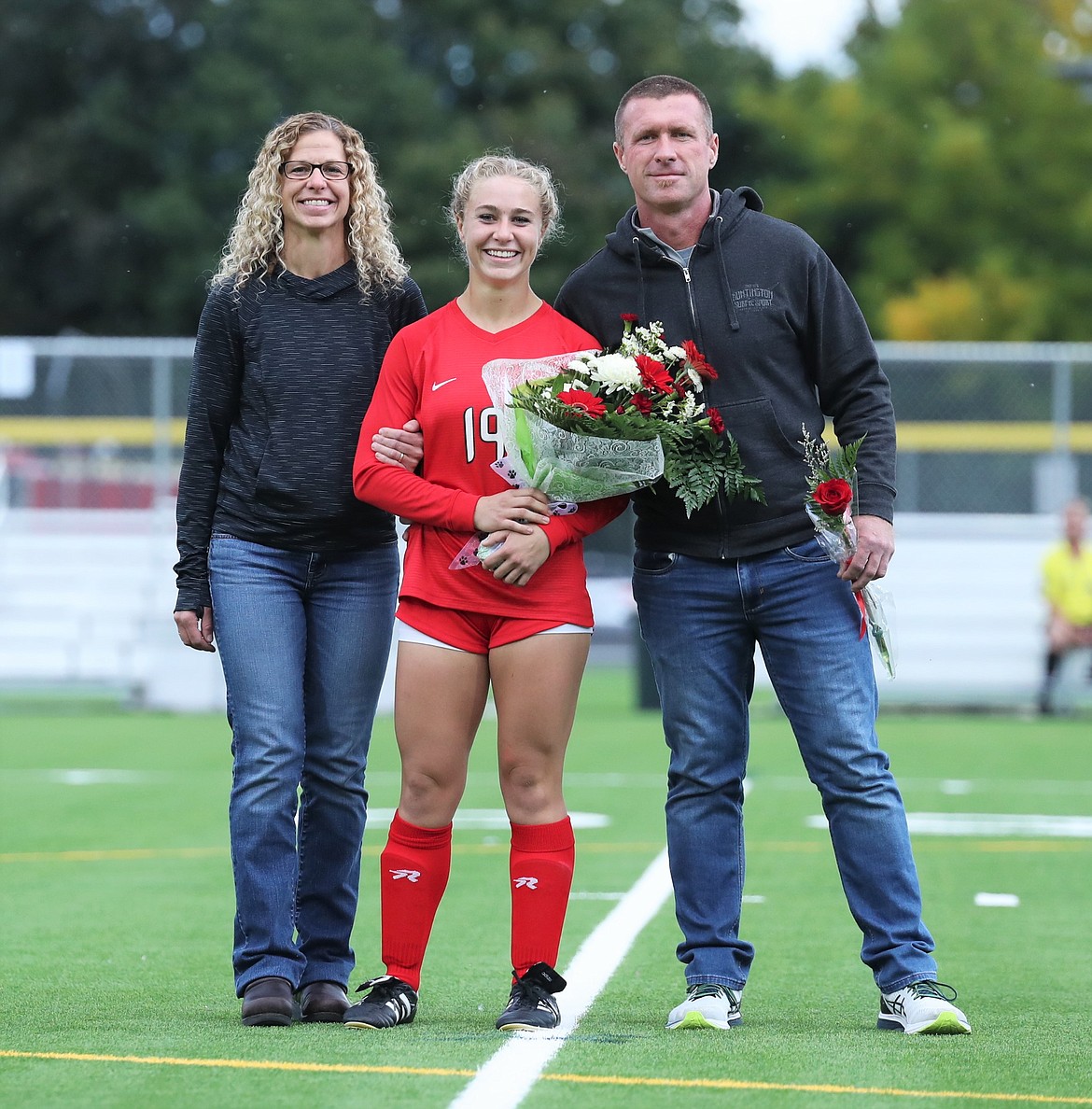 Kalila Tuinstra poses for a photo with her family on Senior Night.