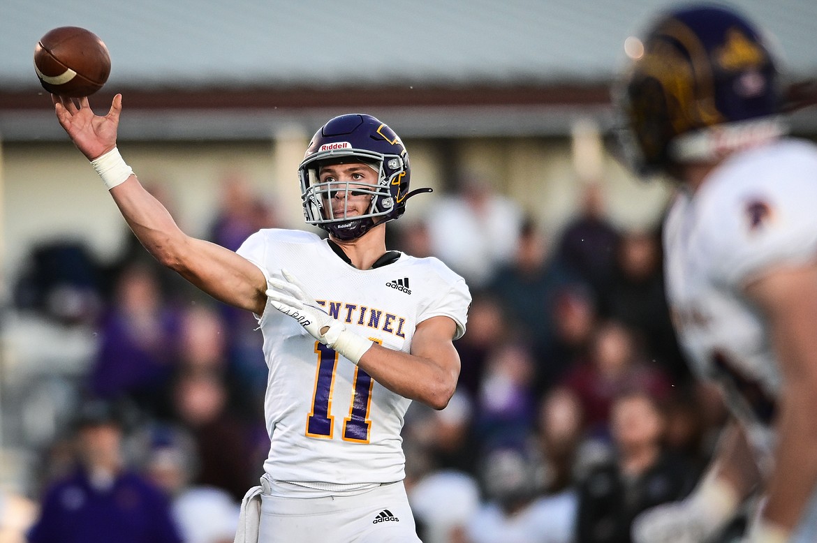 Missoula Sentinel quarterback Zac Crews (11) throws a first-quarter touchdown pass to running back Kellen Curtiss (44) against Flathead at Legends Stadium on Friday, Oct. 1. (Casey Kreider/Daily Inter Lake)