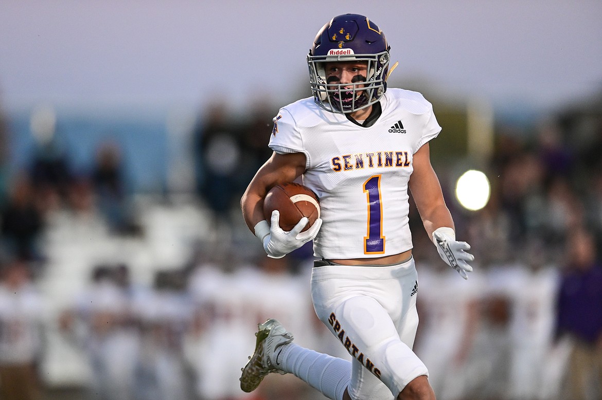 Missoula Sentinel wide receiver Karsen Beitz (1) takes a handoff and looks for running room in the first quarter against Flathead at Legends Stadium on Friday, Oct. 1. (Casey Kreider/Daily Inter Lake)