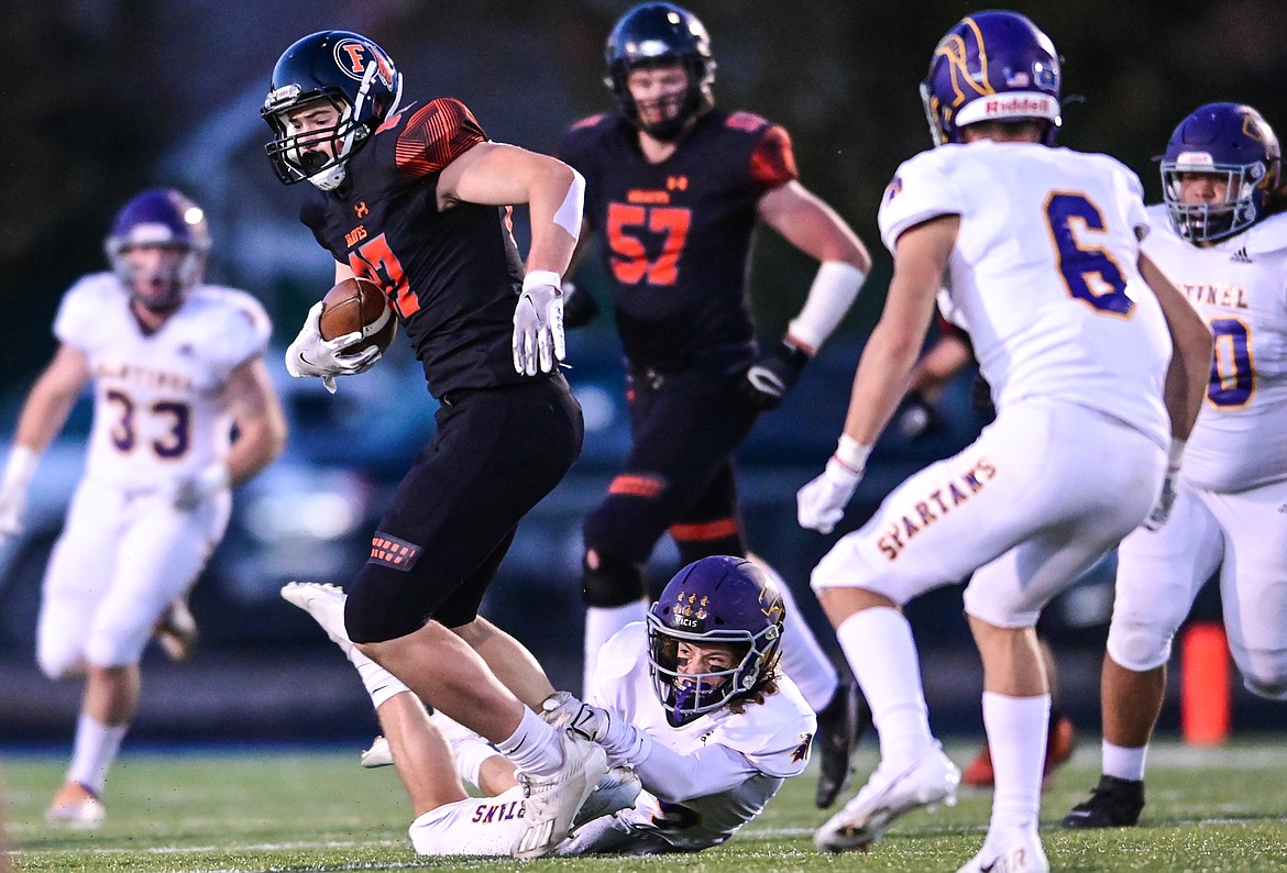 Flathead tight end Caleb Riley (87) is brought down after a reception in the first quarter against Missoula Sentinel at Legends Stadium on Friday, Oct. 1. (Casey Kreider/Daily Inter Lake)