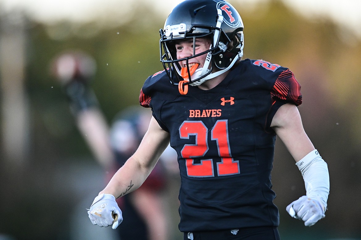 Flathead defensive back Nate Prieto (21) celebrates after the Braves defense recovered a fumble in the first quarter against Missoula Sentinel at Legends Stadium on Friday, Oct. 1. (Casey Kreider/Daily Inter Lake)