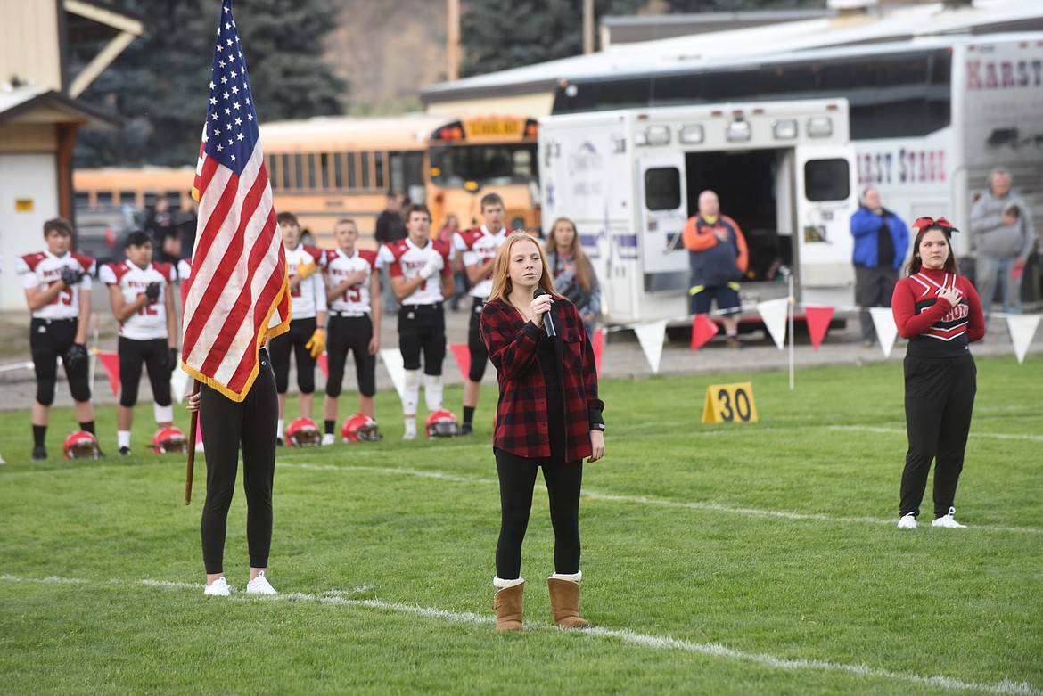 Noxon's Aubrey Erwin sings the national anthem before last Friday's homecoming game against West Yellowstone. (Scott Shindledecker/Valley Press)