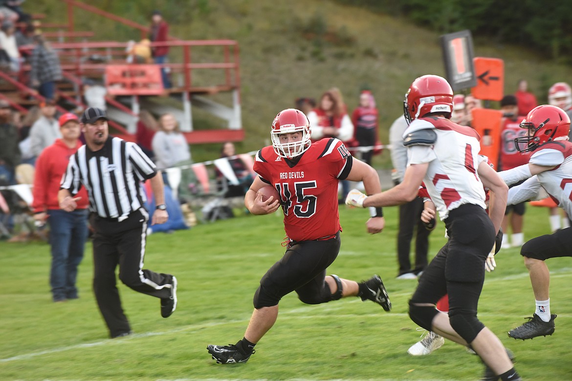 Noxon running back Cade VanVleet heads toward the end zone on a 21-yard touchdown run in the first quarter of last Friday's game against West Yellowstone. West Yellowstone ended up forfeiting the game after one of its players was injured. (Scott Shindledecker/Valley Press)