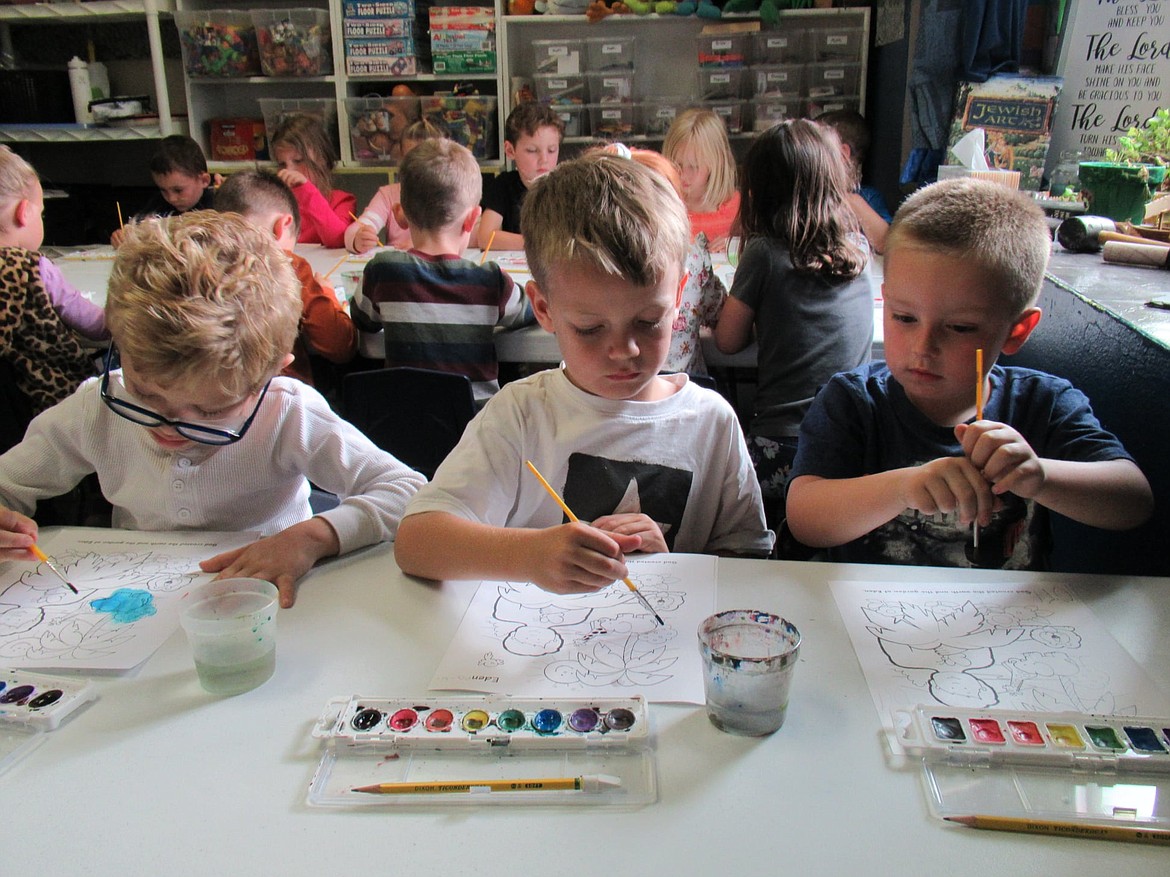 From left, kindergarteners Carter Nesbitt, Parker Stolebarger and Dylan Patterson in Kimberly Young's class at CornerStone Christian Academy work on watercolor in September. Photo courtesy of John Young
