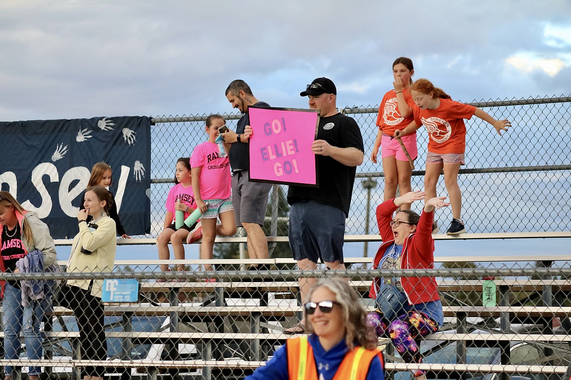 The crowd cheers as runners take off Thursday evening at the Coeur d'Alene School District cross-country run at the Kootenai County Fairgrounds. HANNAH NEFF/Press