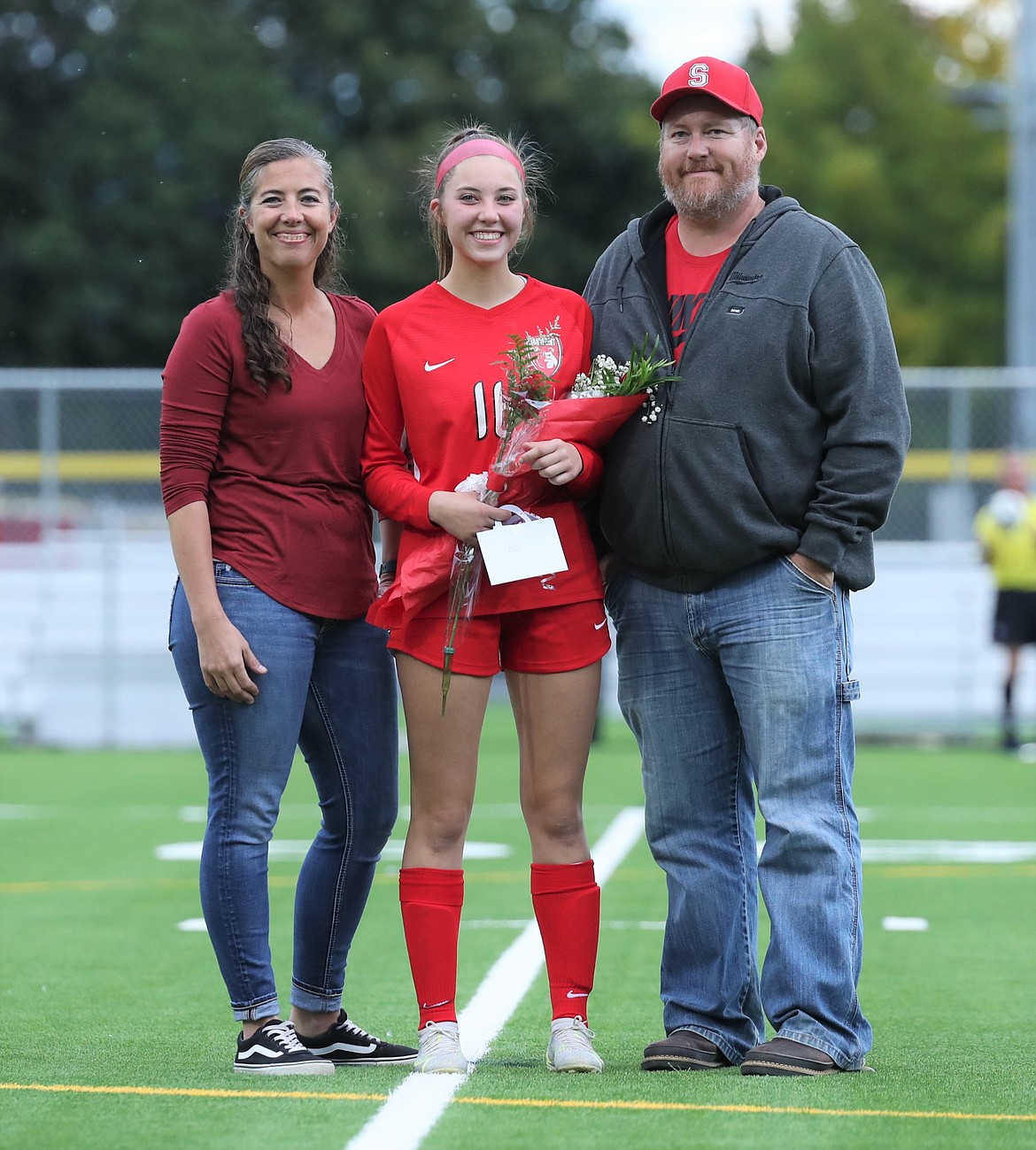 Kylie Williams poses for a photo with her family on Senior Night.