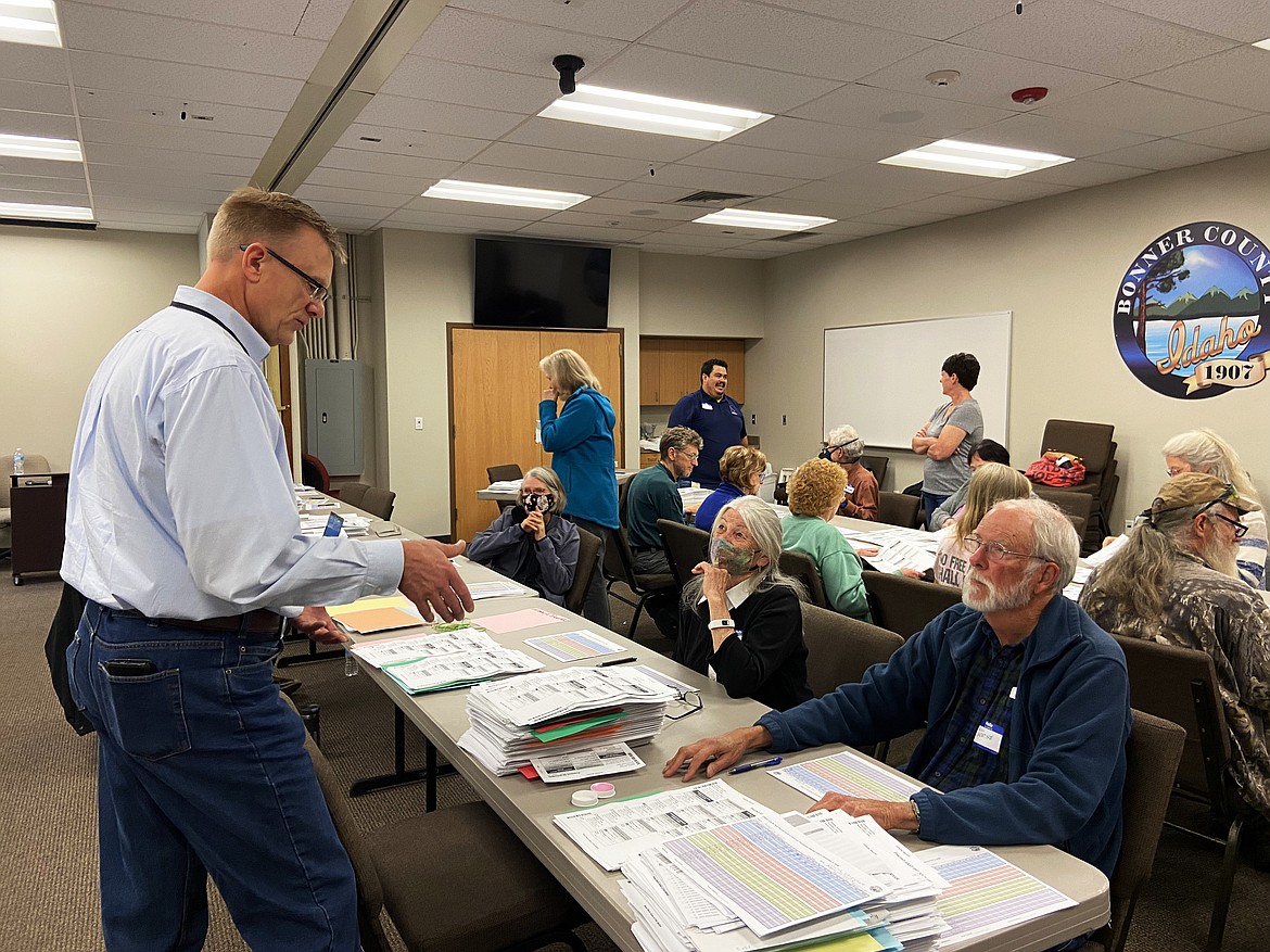 Bonner County Clerk Michael Rosedale talks to volunteers in early October 2021 as they conduct a partial recount of the county's 2020 presidential ballots. Only nine ballots were changed — all of which contained marks too faint for the county's tabulation machine to pick up. The recount was among the year's top stories.