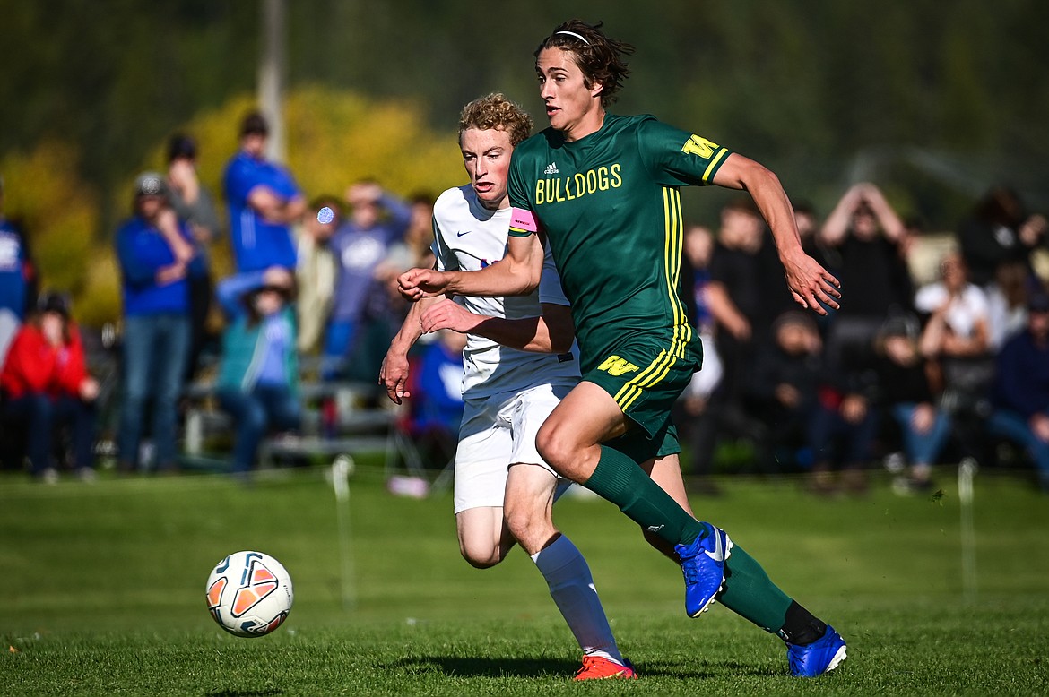 Whitefish's Gabe Menicke (9) makes a run for his first goal of the game against Columbia Falls at Smith Fields on Saturday. (Casey Kreider/Daily Inter Lake)