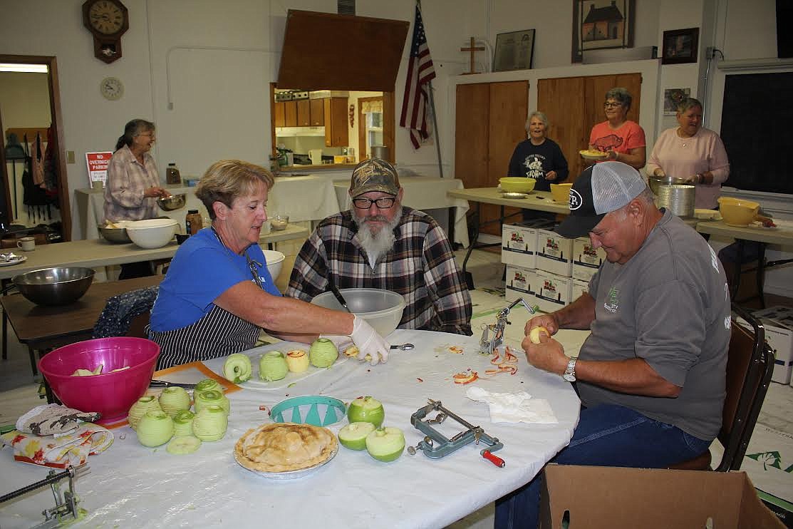 The apple-peeling committee in the apple pie factory at the Old DeBorgia School. The group baked 75 apple pies for one of their fundraisers. (Monte Turner/Mineral Independent)