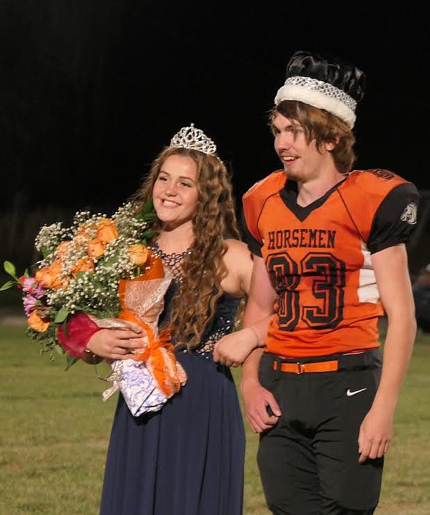 Plains Homecoming Queen Lillian McDonald and King Levi Blood were all smiles during the festivities Saturday night at halftime of the football game against Charlo. (Adam Lindsay/Valley Press)