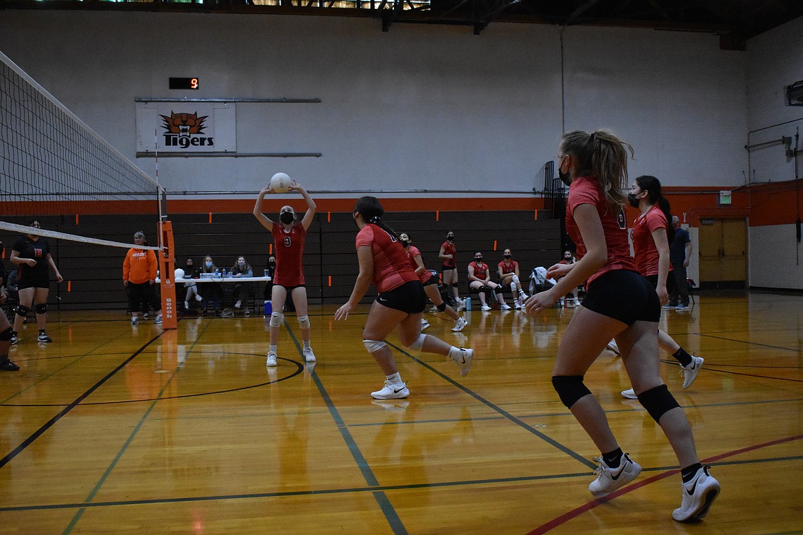 Kalilynn Gomez (3) sets the ball Saturday for teammate Alize Alvarez (17). Gomez is one of only four sophomores on Othello’s varsity volleyball team