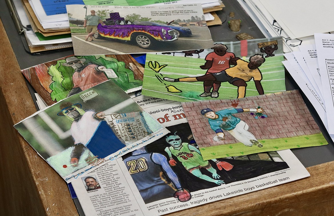 Students in Dawn Myers art class at Lake City High School used copies of The Coeur d'Alene Press for a project on ethics where they altered the photos at least 50% to make the artwork their own. HANNAH NEFF/Press