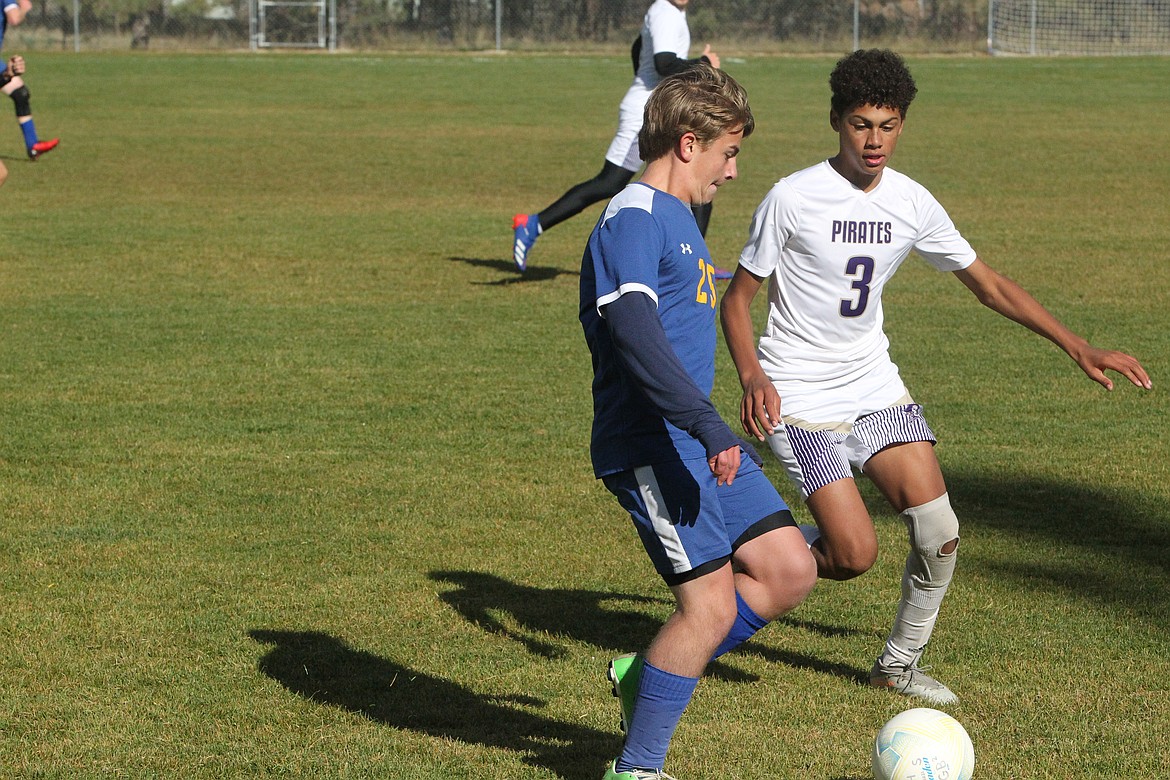 Aaron Thomas looks to get around a defender during an Oct. 2 game against Polson. The Libby boys soccer squad fell 4-2 against the Pirates. Ivan Cano and Sami Jocks each scored for the Loggers. The girls team fell 7-0. (Will Langhorne/The Western News)