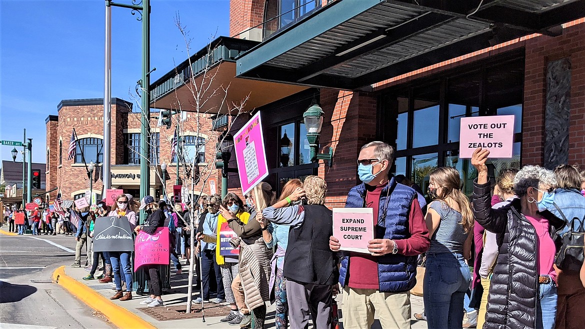 People hold signs in front of the Whitefish City Hall during a reproductive rights rally on Saturday morning. In addition to Whitefish, National Women's March demonstrations were held in Billings, Great Falls, Helena, Missoula and Choteau, as well as over 600 cities across the U.S. (Photo provided)