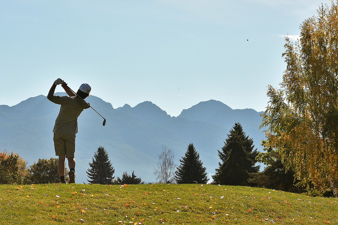 Bulldog Riley Brown tees off at the State A golf tournament in Polson. (Jeff Doorn photo)