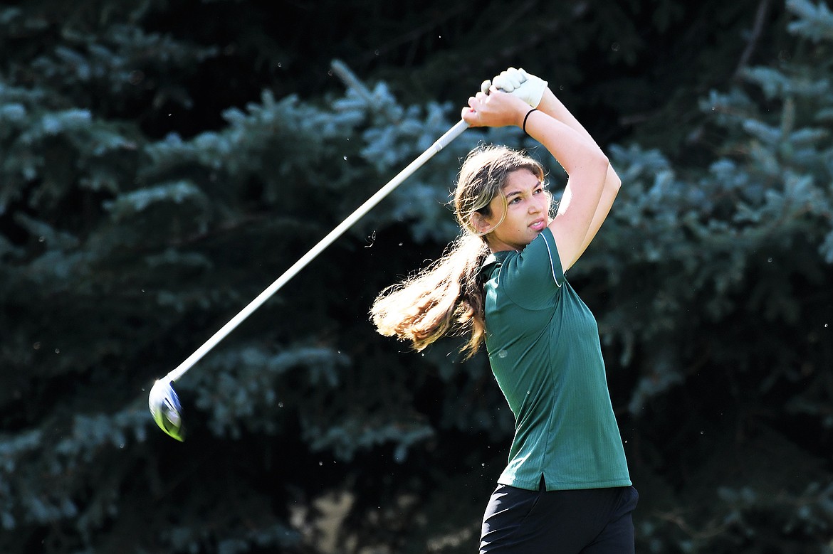 Bulldog Anyah Cripe follows her ball at the State A golf tournament in Polson. (Jeff Doorn photo)