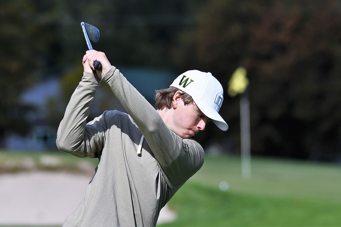 Whitefish’s Bjorn Olson takes a shot at the State A golf tournament in Polson. (Jeff Doorn photo)