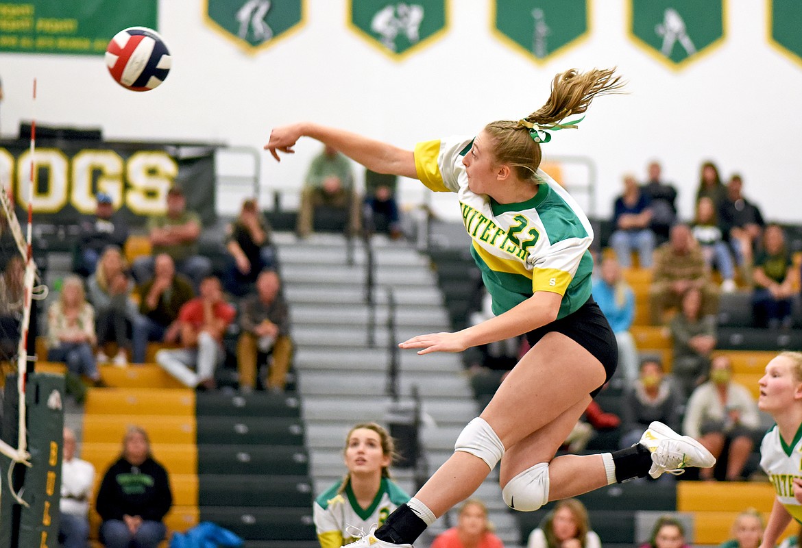 Bulldog Brooke Zetooney spikes the ball for a kill during a match against Browning on Tuesday, Sept. 28 in Whitefish. (Whitney England/Whitefish Pilot)