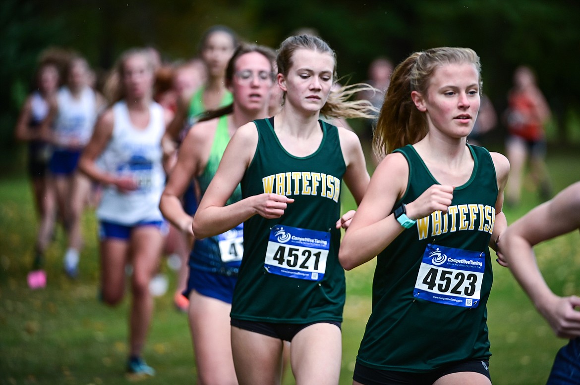 Whitefish's Morgan Grube (4523) and Paetra Cooke (4521) compete at the Whitefish Invite on the South Course of Whitefish Lake Golf Club on Tuesday, Sept. 28. Glacier's Ells took home the win. (Casey Kreider/Daily Inter Lake)