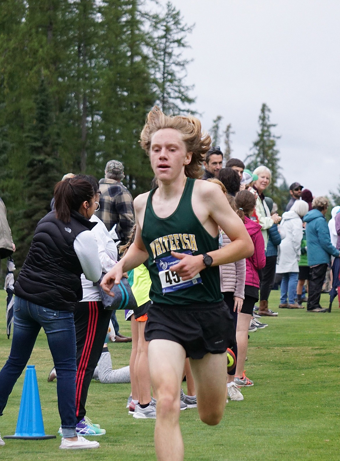 Whitefish senior Jacob Henson finishes fifth overall in the men’s 5,000 meter varsity race with a time of 17:11 at the Whitefish cross country invitational. (Matt Weller photo)