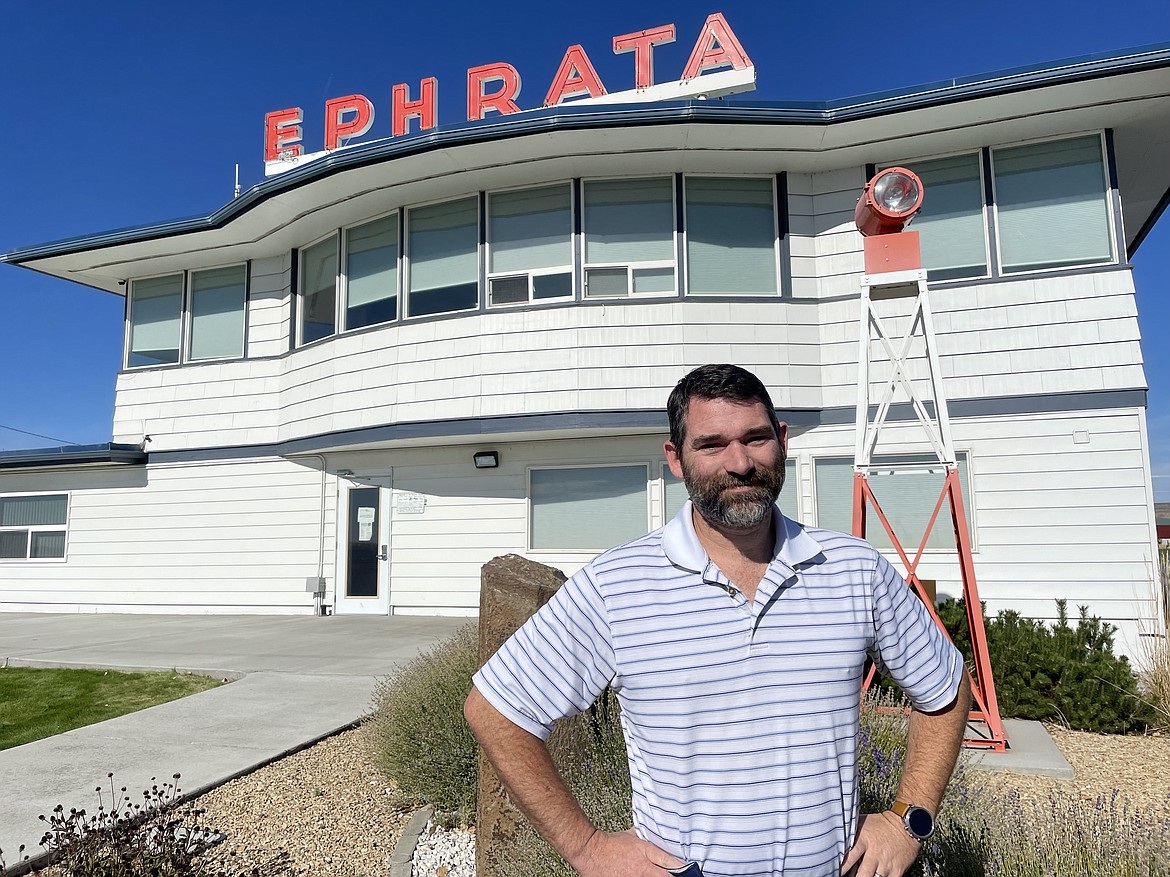 Greg Becken, the executive director of the Port of Ephrata, stands in front of the iconic main building at the Ephrata Municipal Airport.