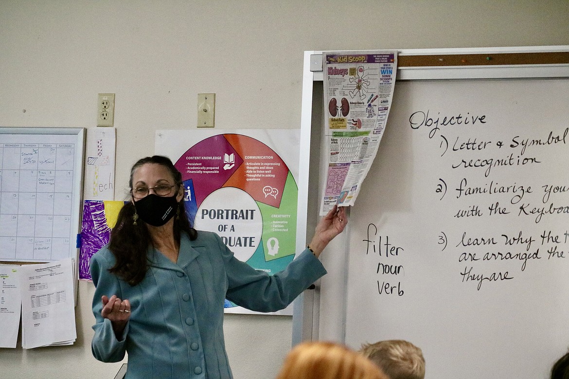 Geri Hagler, a classified staff member at Dalton Elementary School, opens each of her tech prep classes with a few minutes of conversation off Kid Scoop, a section of The Coeur d'Alene Press for kids that covers topics from jokes to career paths. HANNAH NEFF/Press