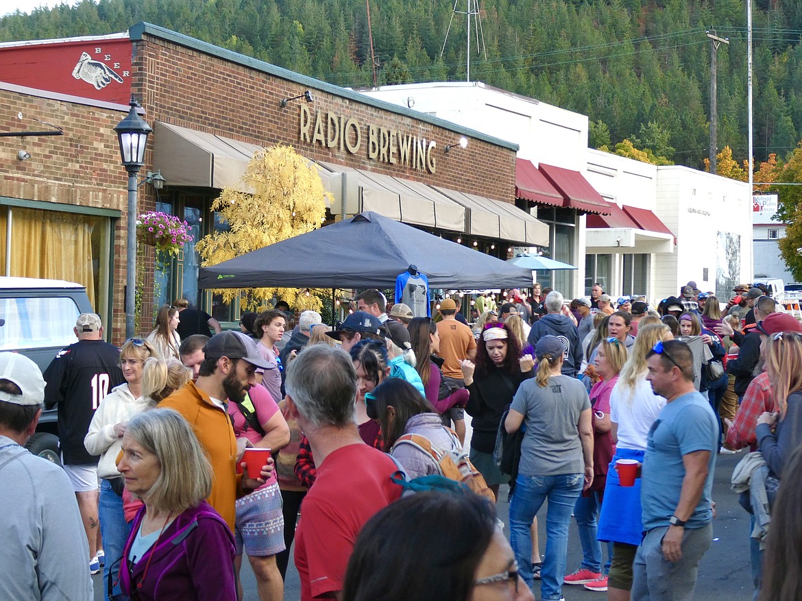 Marathon participants, volunteers, and supporters alike gather outside Radio Brewing Saturday afternoon following the completion of the event.