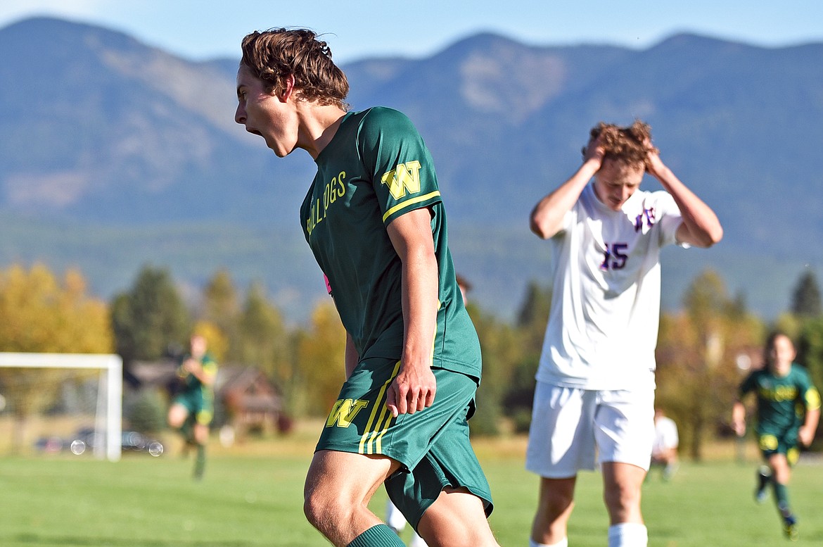 Whitefish senior captain Gabe Menicke celebrates scoring a first-half goal against Columbia Falls on Saturday in Whitefish. Menicke scored all five of the Bulldogs' goals in the game. (Whitney England/Whitefish Pilot)