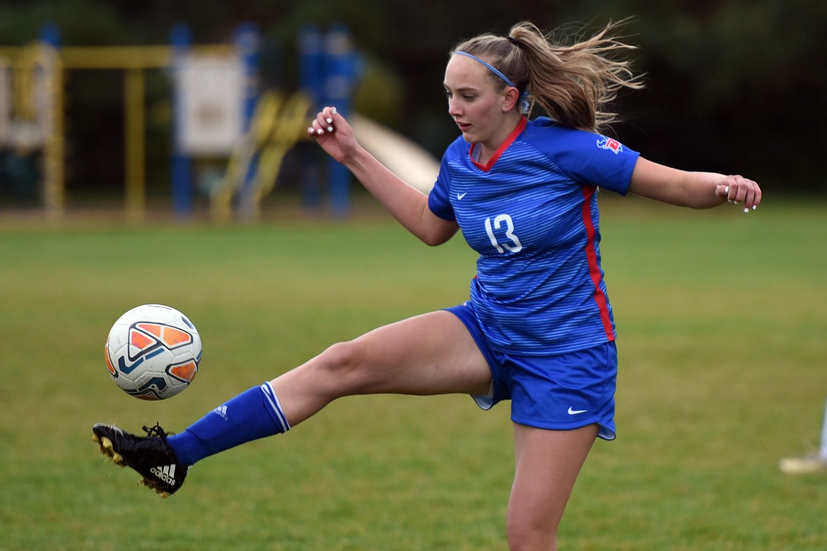 Valkyrie Callie Gembala knocks down a pass during action against Columbia Falls Tuesday. (Jeremy Weber/Bigfork Eagle)