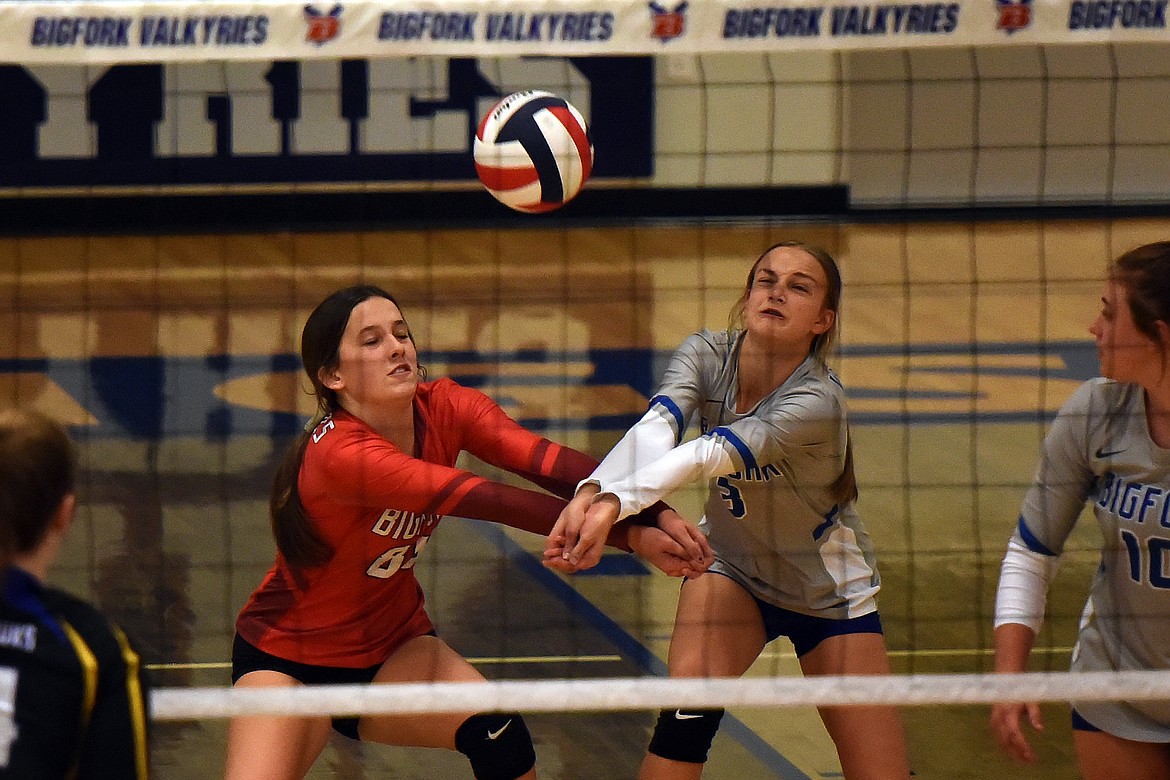 Bigfork's Callie Martinz (88) and Isabella Ellison (3) both attempt to receive a serve from Thompson Falls during the second set Saturday. (Jeremy Weber/Bigfork Eagle)