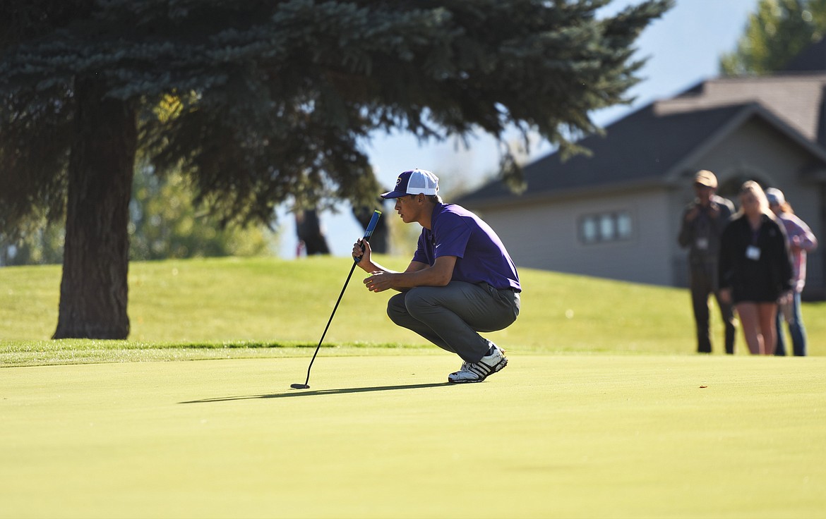 Polson's Christian Lund lines up a putt during the Class A state tournament at Polson Bay Golf Course. (Scot Heisel/Lake County Leader)