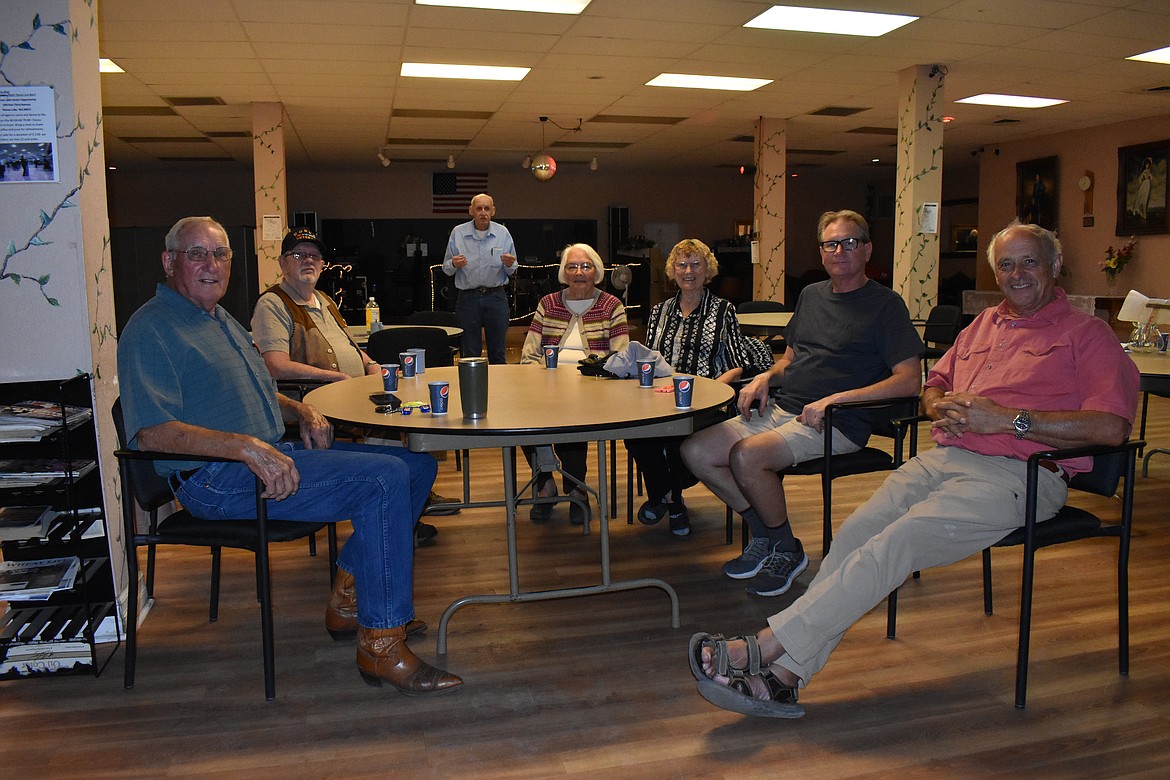 From left, Phil O’Neill, Joe Bass, Mary Harrington, Genie Wehling, Ron Sawyer and Gord Radom mingle at the dance.