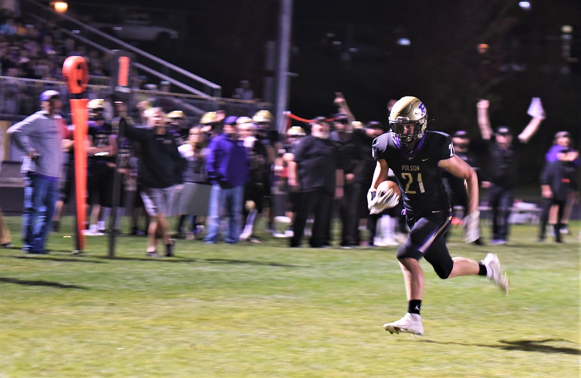 Junior running back Dawson Dumont scores on a pass reception against Columbia Falls. (Scot Heisel/Lake County Leader)