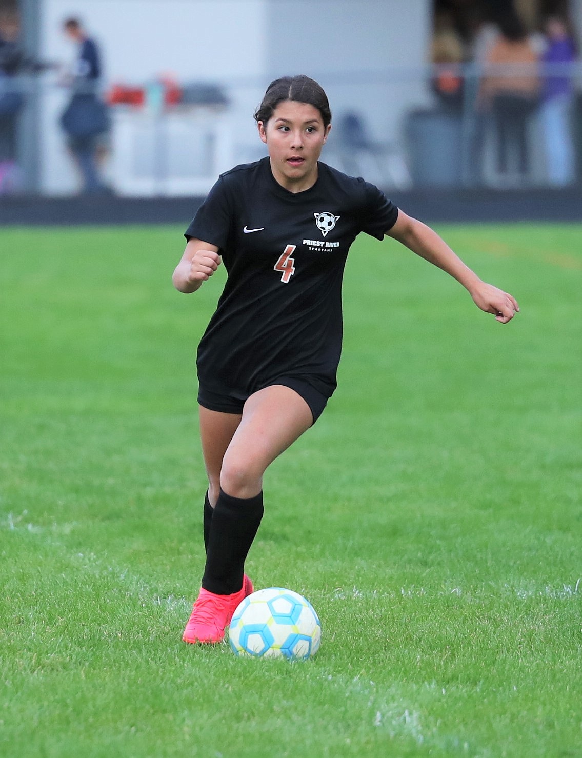 Freshman Lizzie McCracken pushes the ball upfield during a home match against Bonners Ferry on Sept. 28.