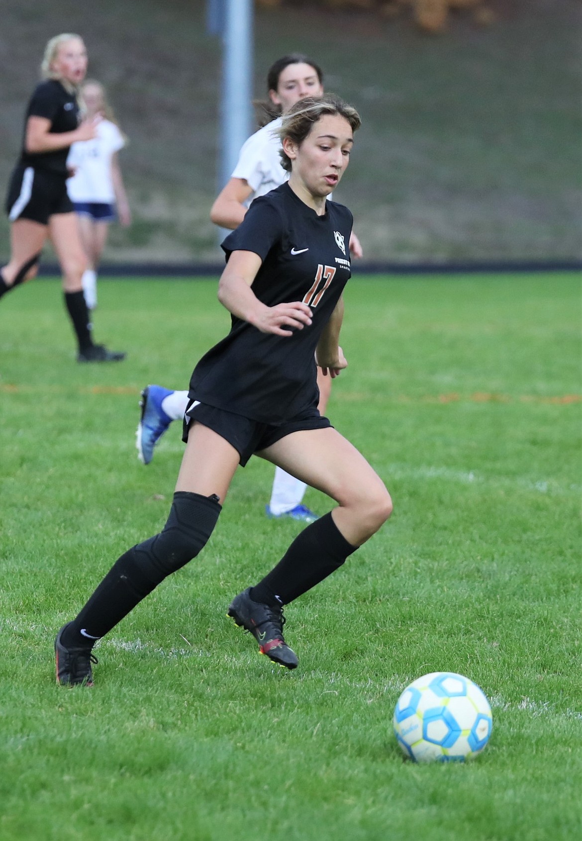 Freshman Lucy Bowen tracks down a loose ball during a home match against Bonners Ferry on Sept. 28.