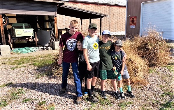 Scout Troop 1947 members and a member of Cub Scout Pack 4947, plus family and friends, recently helped tidy up outside the Polson Flathead Lake Museum on Main Street. They also assisted board members in loading aluminum beverage cans onto a truck for delivery to the recycling center in Kalispell. Aluminum beverage cans can be donated at the recycling bin in the alley between the museum and OHS’ Body Shop. Proceeds benefit the museum. (Courtesy photo)