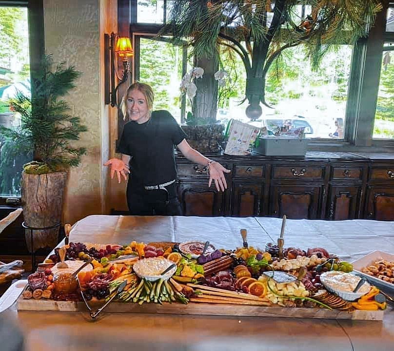 Raegan Hartley and one of the "grazing boards" she created for Montana Picnic Company (courtesy photos).