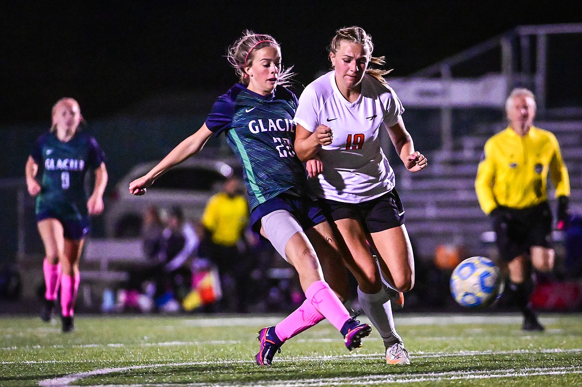 Glacier's Reagan Brisendine (22) looks to shoot with Flathead's Alivia Rinehart (19) defending in the first half at Legends Stadium on Thursday, Oct. 7. (Casey Kreider/Daily Inter Lake)