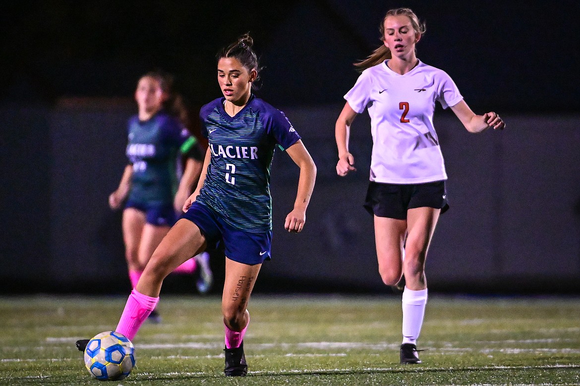 Glacier's Calista Wroble (2) pushes the ball upfield against Flathead in the first half at Legends Stadium on Thursday, Oct. 7. (Casey Kreider/Daily Inter Lake)