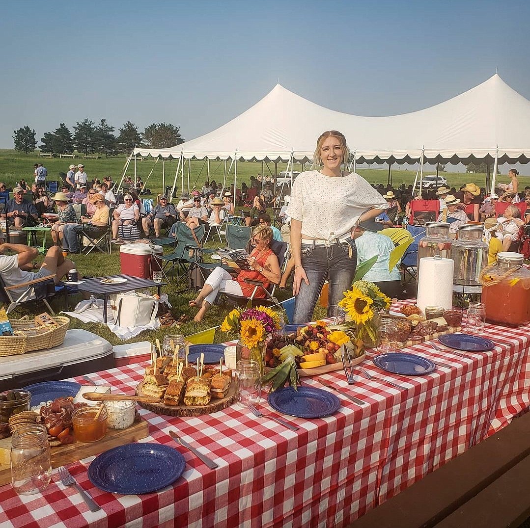 Raegan Hartley shows off her grazing boards at an event with Montana Picnic Company (courtesy photos).