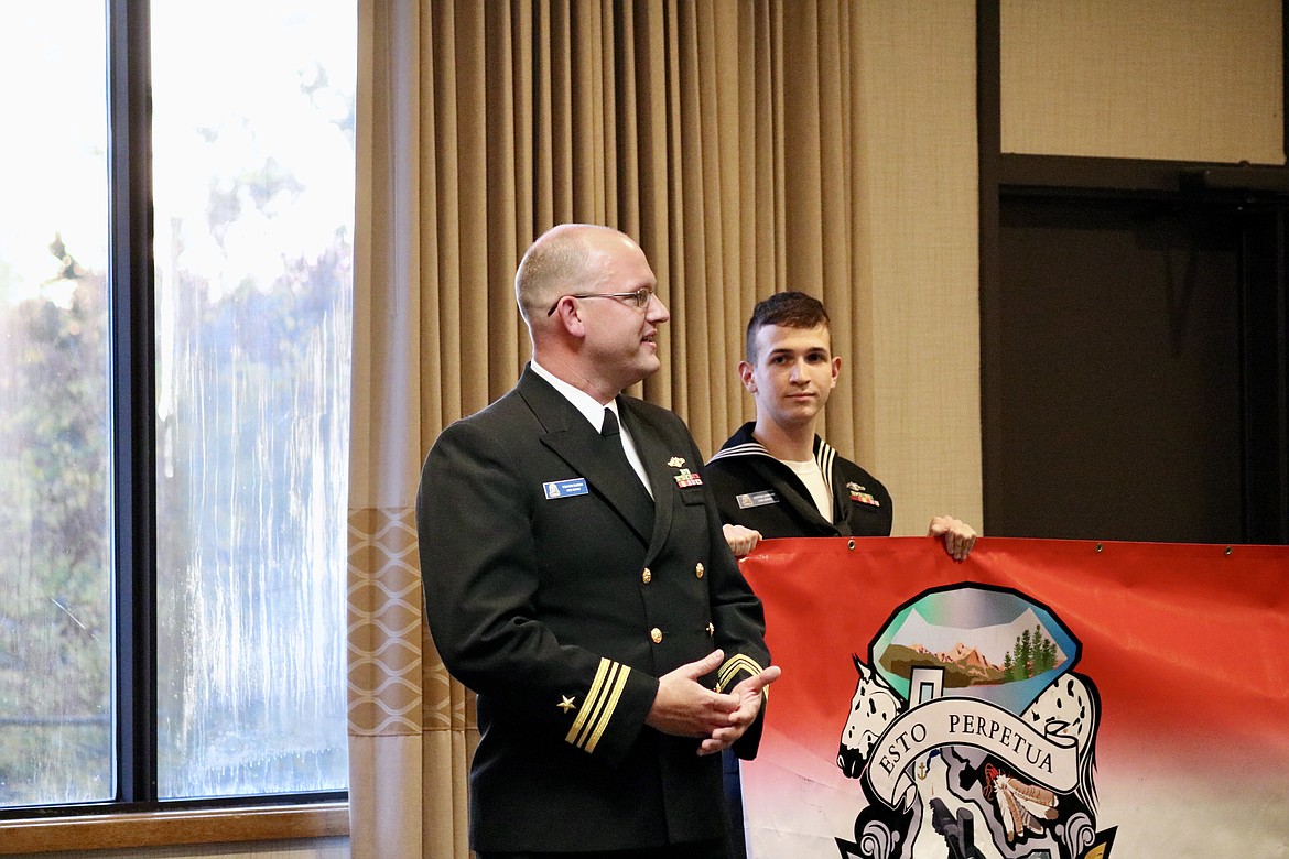 Idaho native Lt. Cmdr. Trevor Elison speaks at the meet and greet reception Wednesday evening at Red Lion Hotel Templin's on the River in Post Falls. Behind him on the right is Machinist's Mate Nuclear 2nd Class Petty Officer Joshua Jordan. HANNAH NEFF/Press