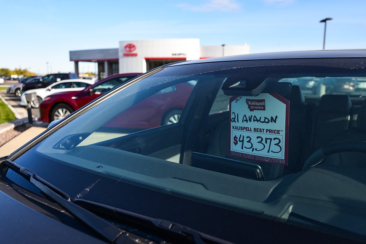 The price tag of a 2021 Toyota Avalon hangs on the rear view mirror at Kalispell Toyota on Friday, Oct. 8. (Casey Kreider/Daily Inter Lake)