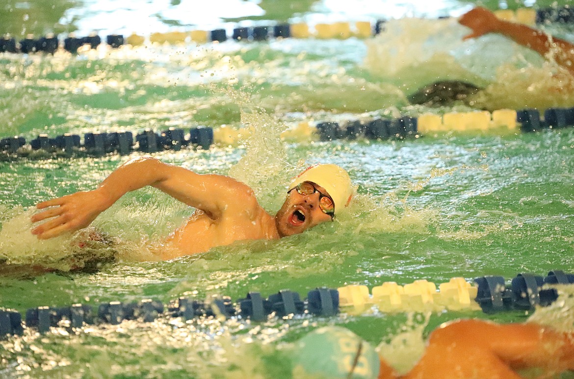 Senior Jack Grzincic competes in the 200-meter freestyle during Friday's dual. The Bulldogs honored their seniors during the home meet.