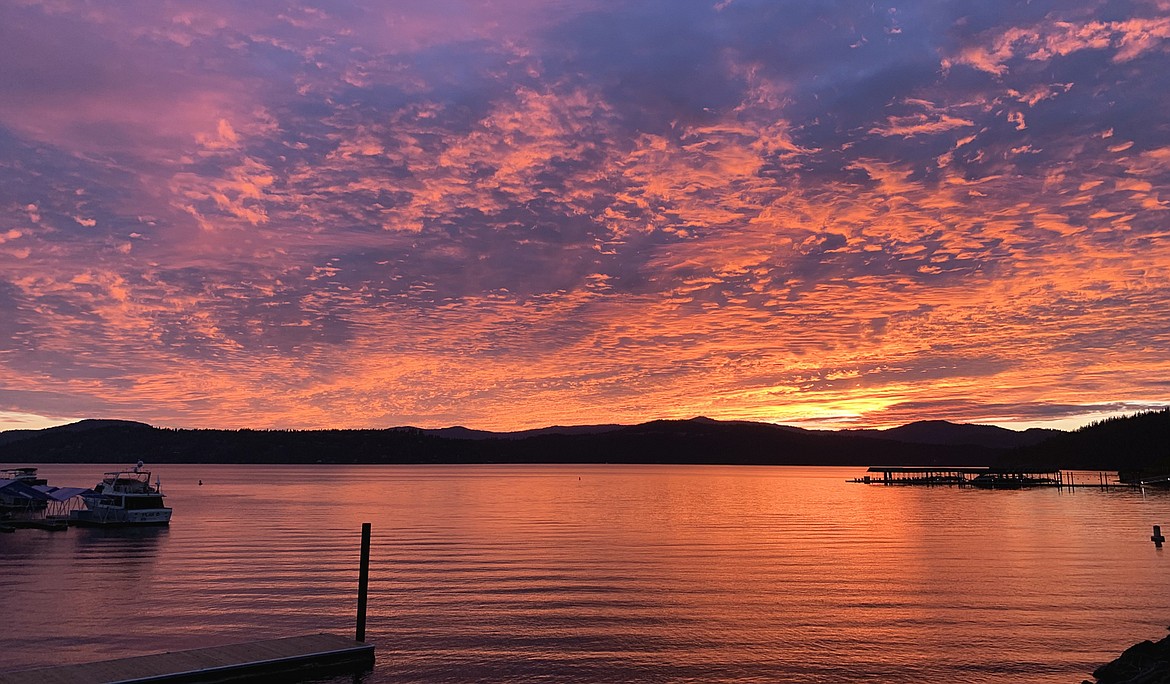 The sky turns golden over Lake Coeur d'Alene during a spectacular Saturday sunset.