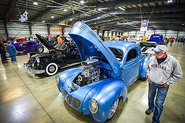 Patrons walk through rows of classic, custom vehicles at the Glacier Street Rod Association's 40th annual car show at the Flathead County Fairgrounds on Saturday, Oct. 9. (Casey Kreider/Daily Inter Lake)