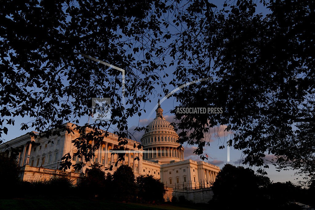 The U.S Capitol at sunset in Washington, on Sept. 30, 2021. Year-end pileups of crucial legislation and the brinkmanship that goes with it are annual rituals for Congress. But this time, testy lawmakers are barreling toward an autumn of battles that are striking for the risks they pose to both parties and their leaders. Miscalculate and there could be a calamitous federal default, a collapse of Biden's domestic agenda and, for good measure, a damaging government shutdown. (AP Photo/Andrew Harnik, File)