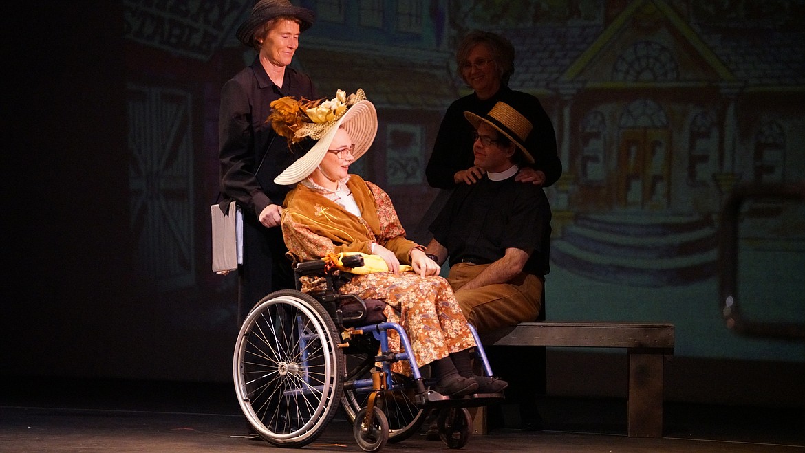 In this 2019 photo, actress Anette Enger, in wheelchair, is supported by shadow Laurie Akins. To the left actor Ron Hebert is supported by shadow Nicola Hebert. Out of the Shadows Theater is a theater group for people with special needs. This photo was taken at their last show, "The Music Man Jr." at the Salvation Army Kroc Center theater before COVID-19 closed down performances. Photo courtesy of Out of the Shadows Theater