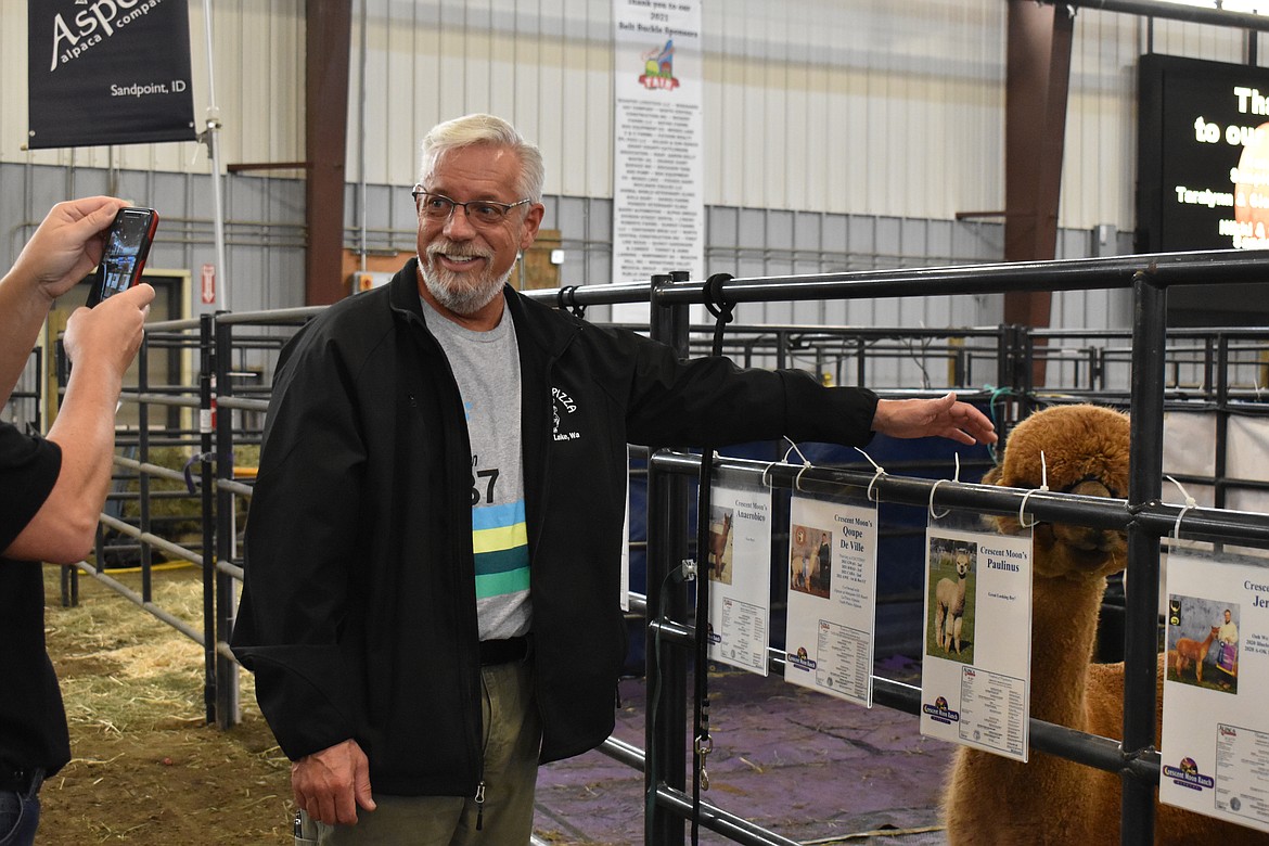 Mitchell Zornes poses for a picture next to an alpaca, taken by friend Kelly Owens.