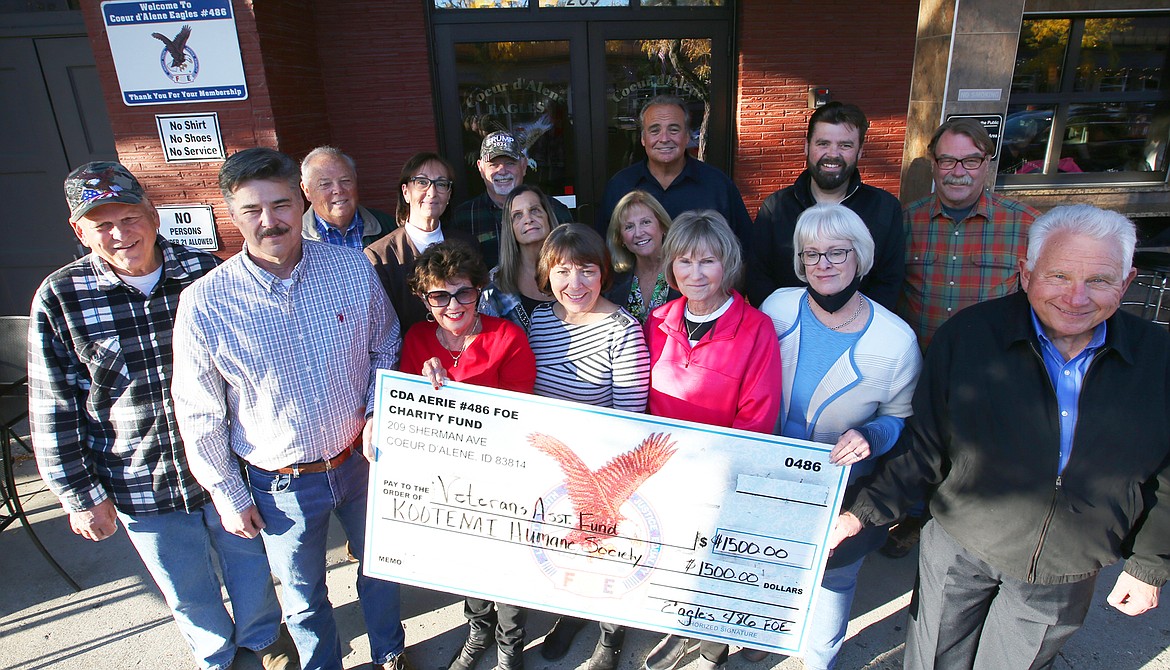 The Coeur d'Alene Eagles recently donated $1,500 each to the Veterans Association Fund and the Kootenai County Humane Society. Front row from left, Tom Freeman. Rosemary Phillips, Julie Moser, Linda Debo, Debbie Jeffrey, KHS executive director, and Len Crosby. Back row from left, Gene McCloskey, Chuck Labrow, Vicky Nelson of KHS, Larry George, Gail McCloskey, Michelle Van Horne, Scott Van Horne, Dustin Okon and Bruce Walker.