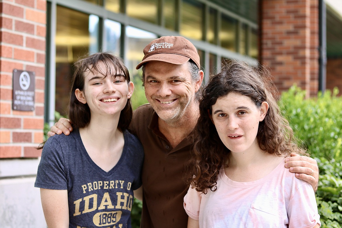 Tim Neary with daughters Emma Neary, 20, on left, and Megan Neary, 24. Megan Neary will be performing in Out of the Shadows theater's fifth production, "Bye Bye Birdie - Young Performers Edition," at the end of October and first weekend of November with her dad as her shadow actor. HANNAH NEFF/Press